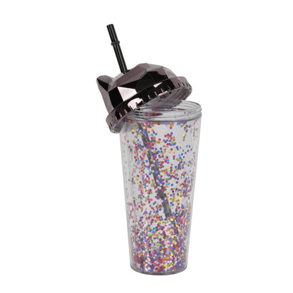 Cat-themed glitter tumbler cup with a straw